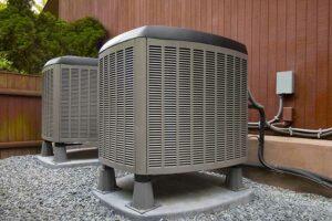 Technician inspecting residential HVAC system for repair.