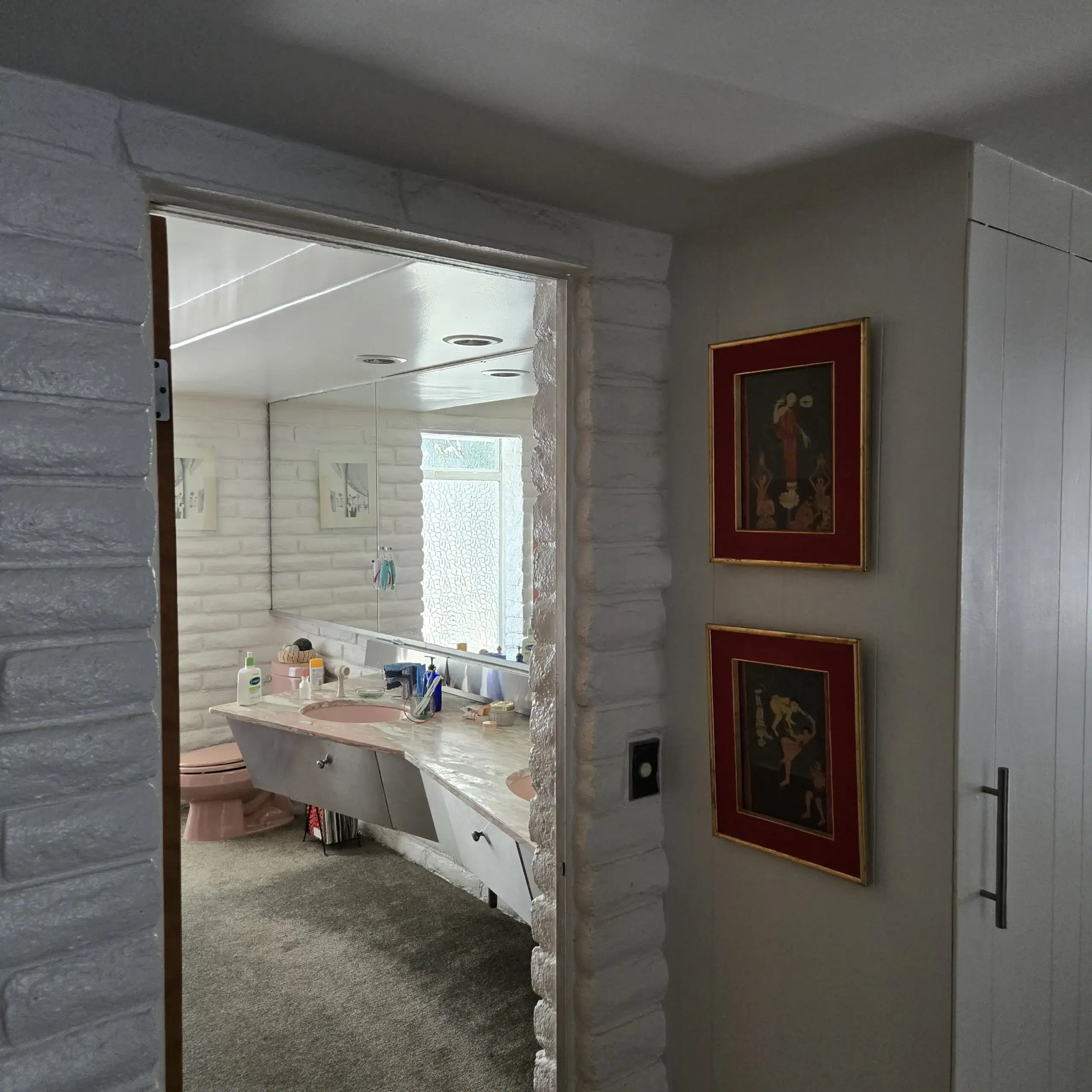 â€œBathroom with old carpet flooring before radiant heating installation near Universal Studios.â€